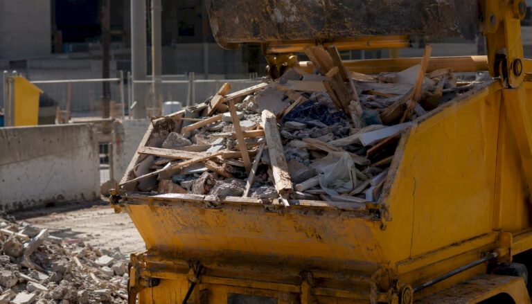 Construction waste truck loading debris in Sydney