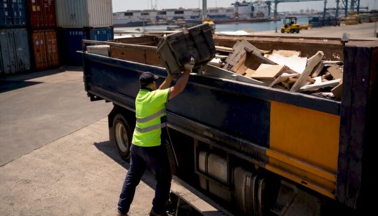 Rubbish removal truck loading office waste