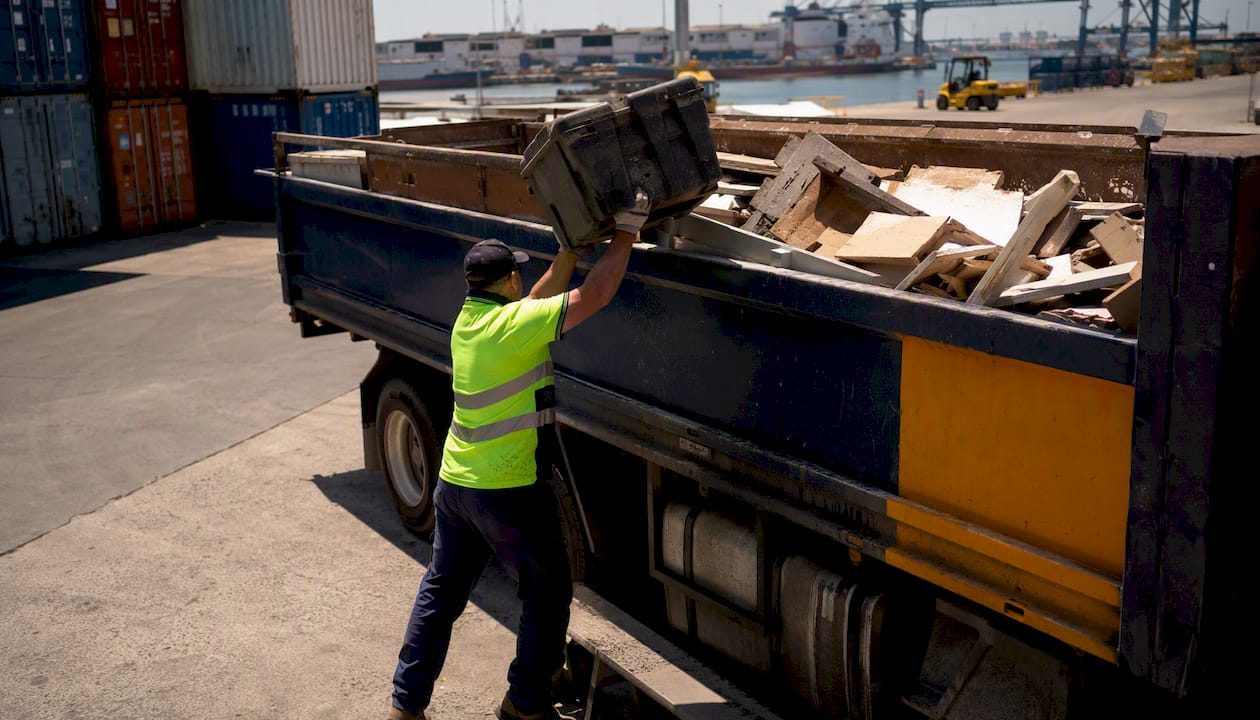 Rubbish removal truck loading office waste