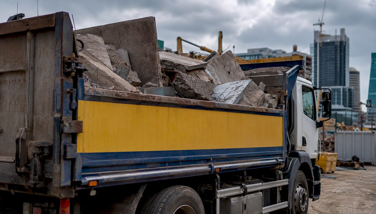 Rubbish removal truck loading vinyl waste