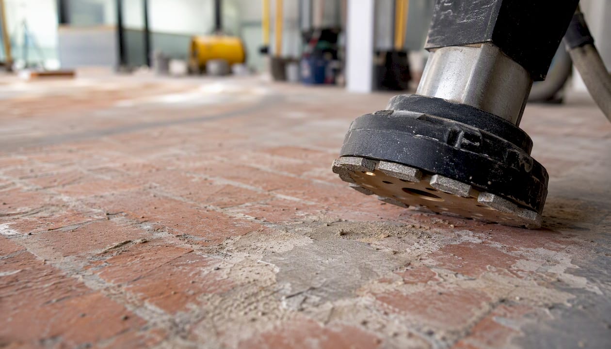 Diamond cup grinder disc cleaning on brick