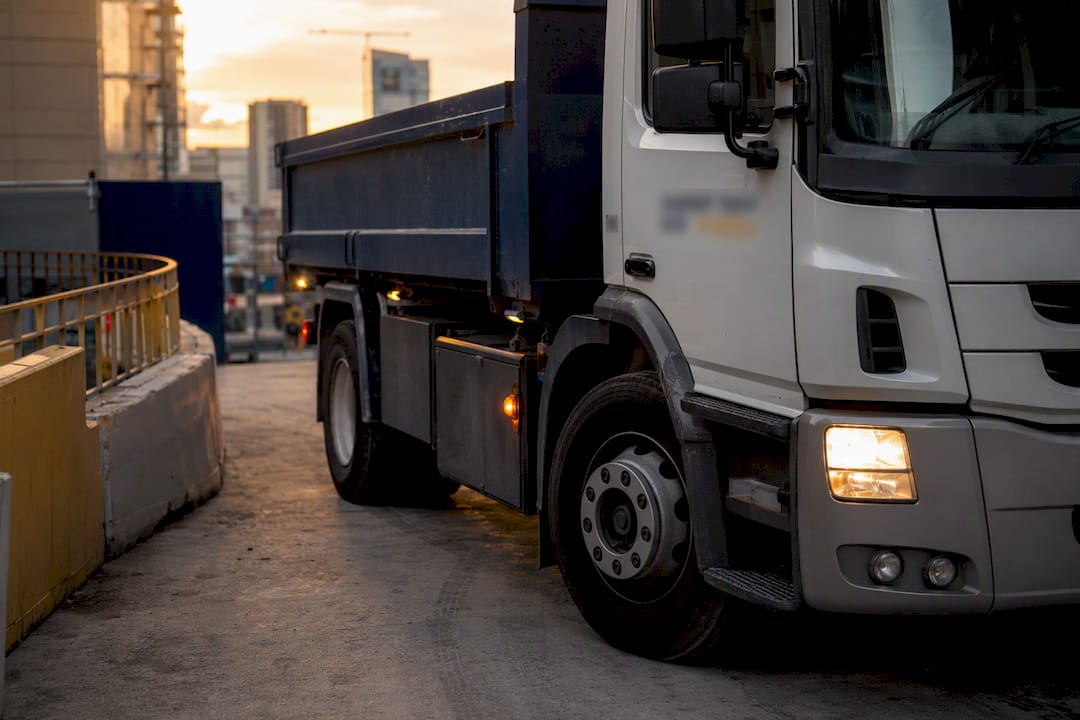 Rubbish truck entering tight construction site access