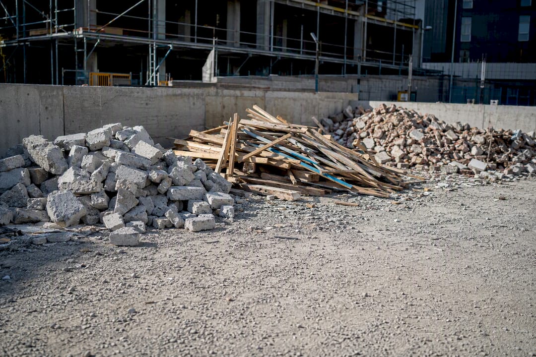 Separated construction waste piles on site