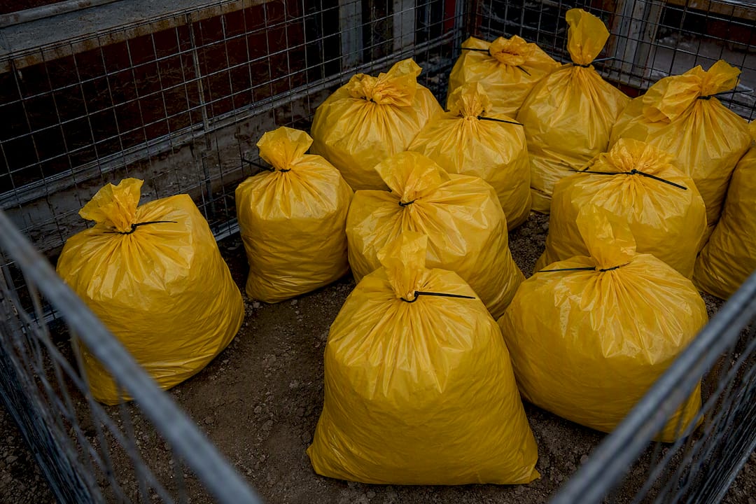 Sealed hazardous waste bags at site