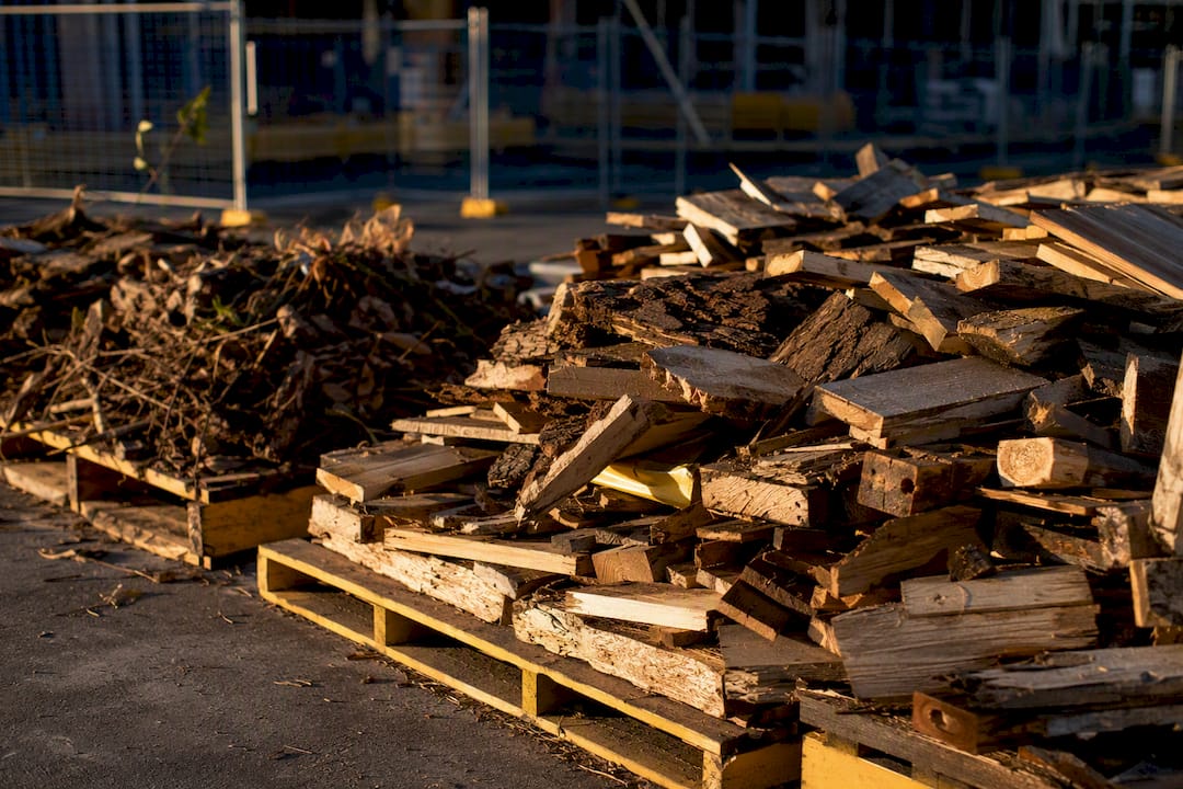 Stacked timber waste offcuts on pallets