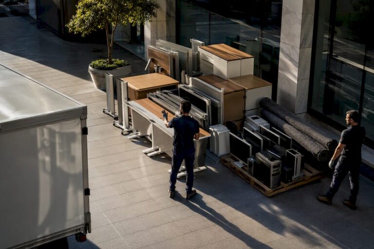 Crew staging commercial office waste for removal
