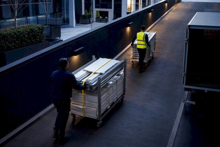 Commercial crew loading office waste at service dock