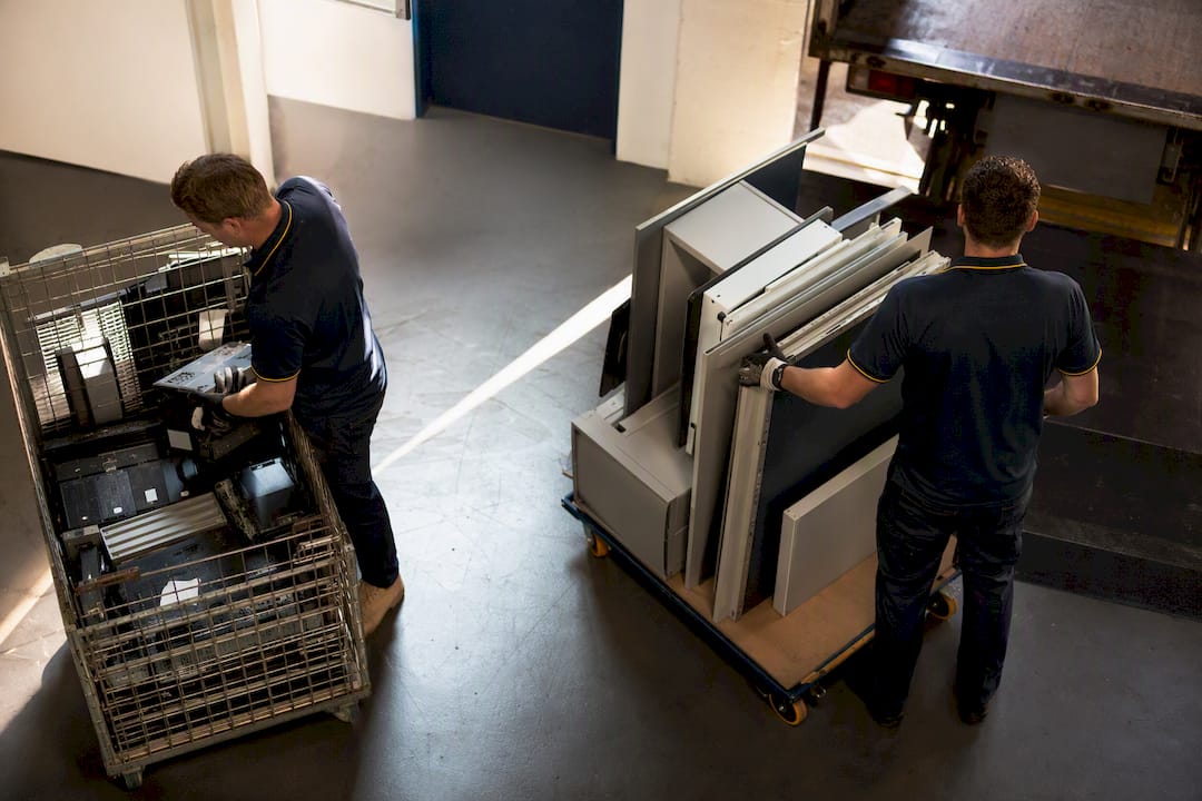 Crew sorting commercial bulky waste and e-waste