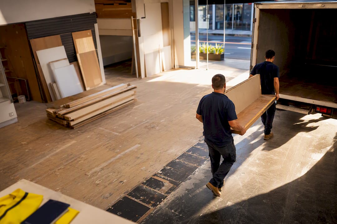 Workers loading retail defit materials in Sydney